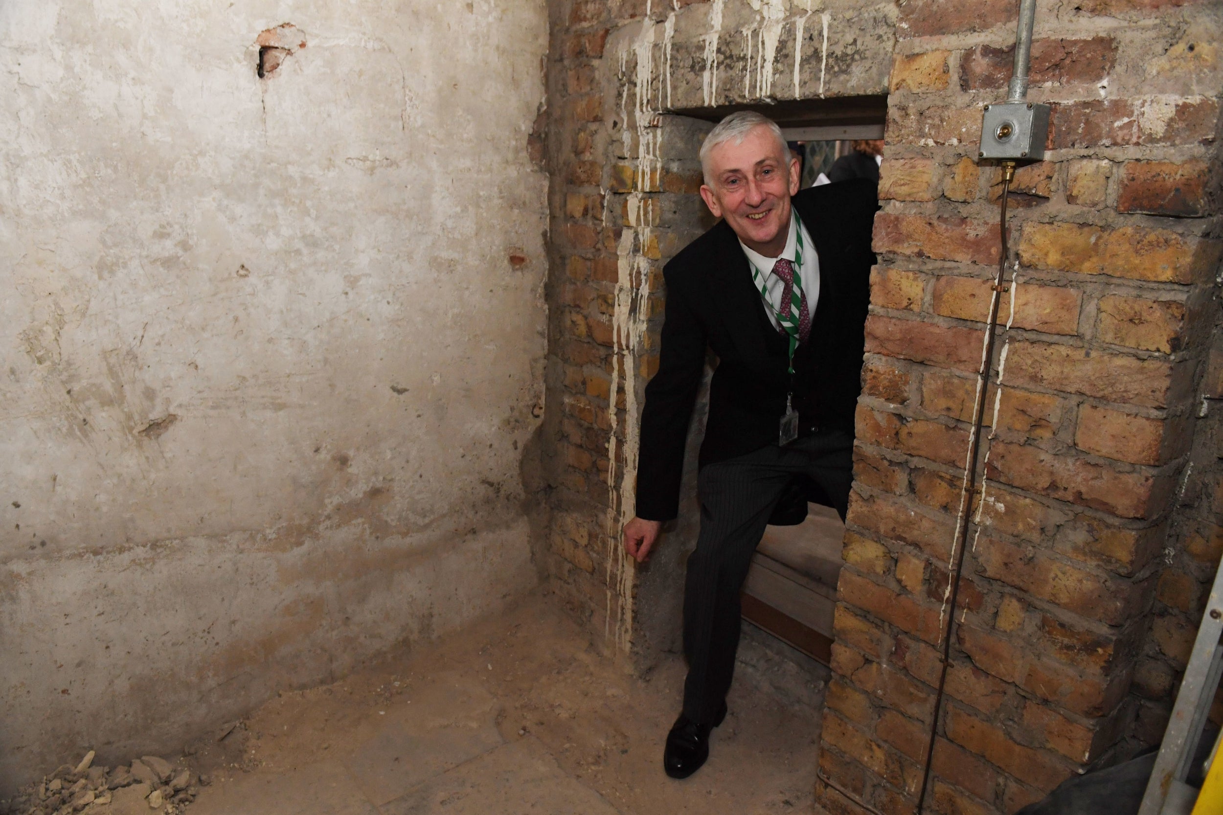 Speaker Lindsay Hoyle walks through a secret doorway that has been rediscovered in the House of Commons