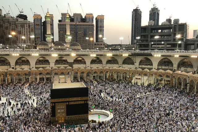 Muslim worshippers pray and circumambulate around the Kaaba, Islam's holiest shrine, at the Grand Mosque in Saudi Arabia's holy city of Mecca, 25 August 2018.