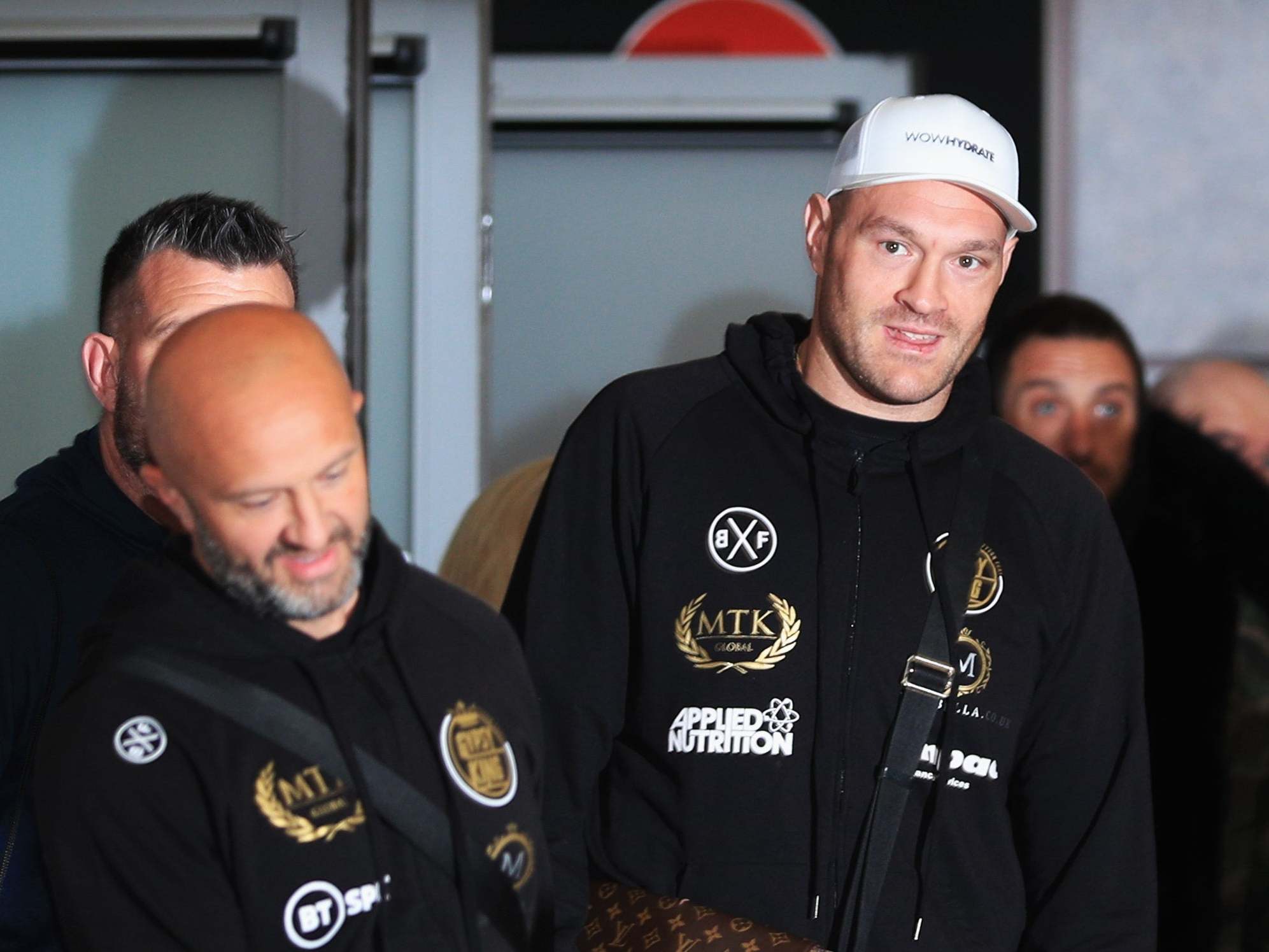 Tyson Fury arriving back at Manchester Airport