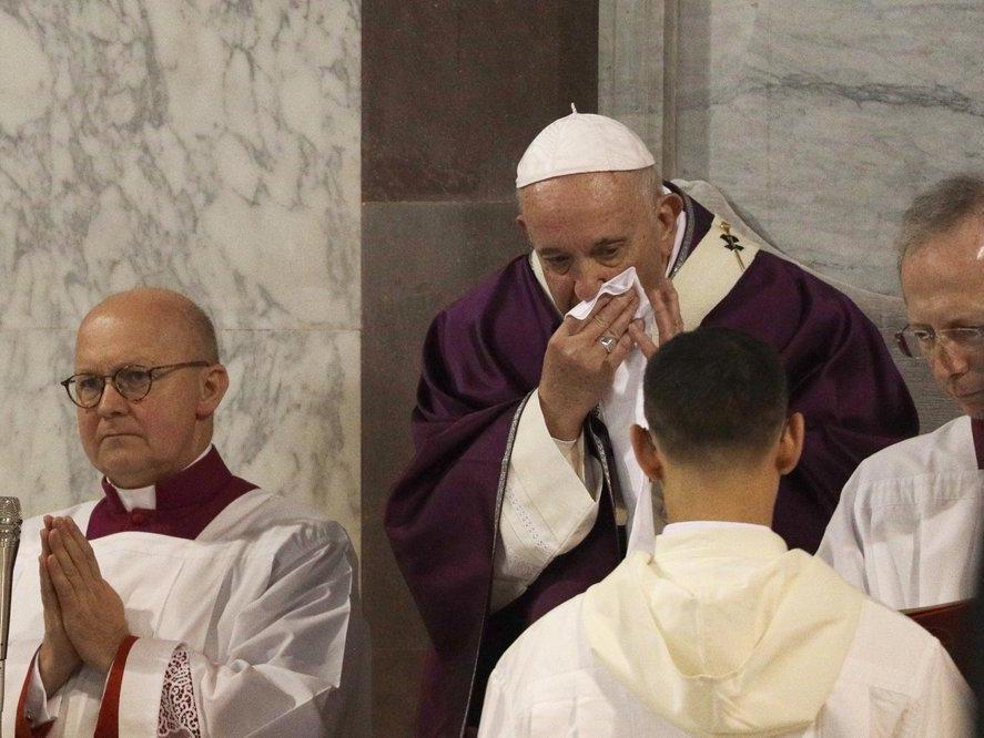 Pope Francis wipes his nose during the Ash Wednesday Mass opening Lent, the forty-day period of abstinence and deprivation for Christians before Holy Week and Easter, inside the Basilica of Santa Sabina in Rome