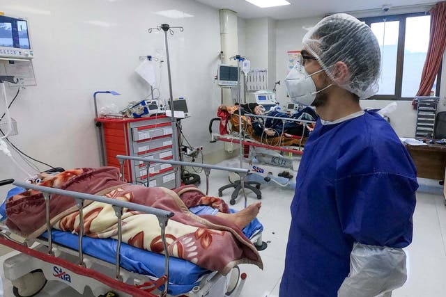 A nurse cares for patients in a coronavirus ward at Forqani Hospital in Qom, Iran