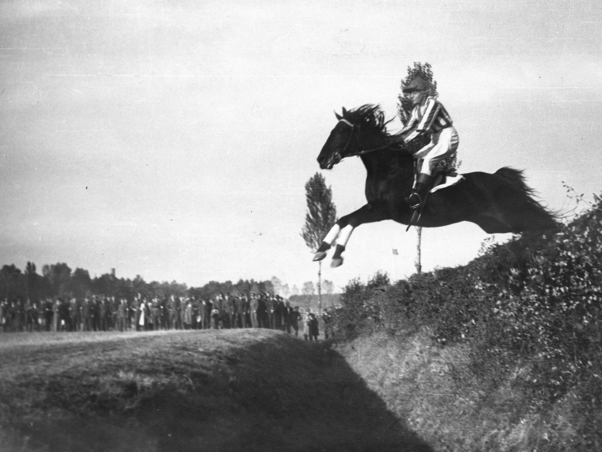 Lata jumps Taxis on Otello in the 1947 Grand Pardubice​