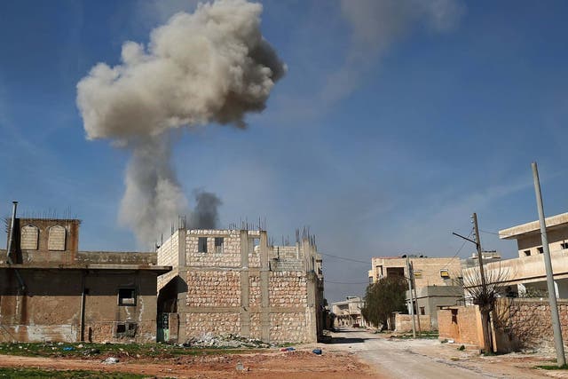 Smoke billows over the town of Saraqib in Idlib, following bombardment by Syrian government forces on 27 February