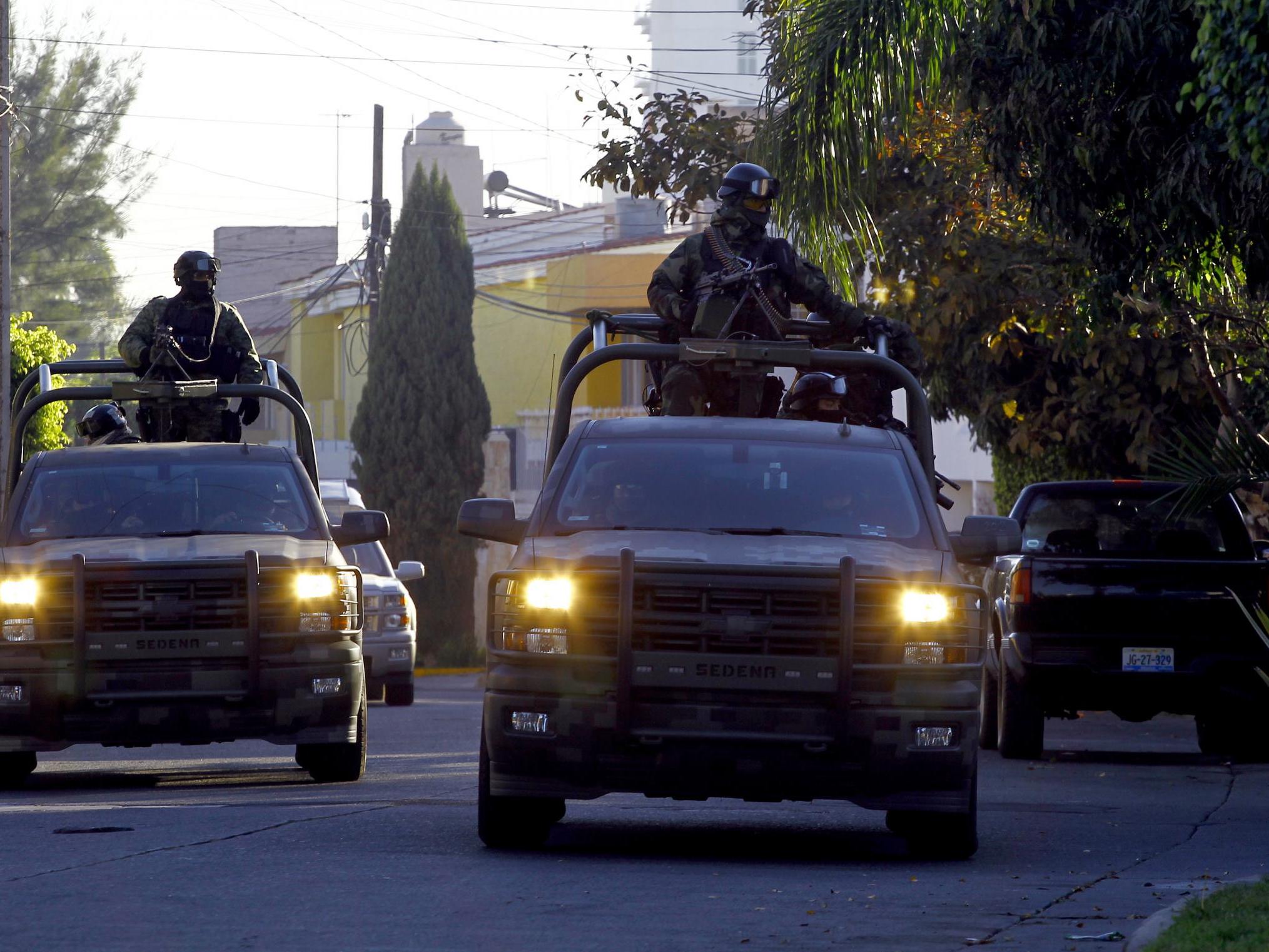 Mexican soldiers patrol the Jardines Universidad zone during a military operation during which Ruben Oseguera Gonzalez, aka "el Menchito" son of the leader of the Jalisco next Generation cartel, was then arrested, in Guadalajara, Mexico on 30 January 2014