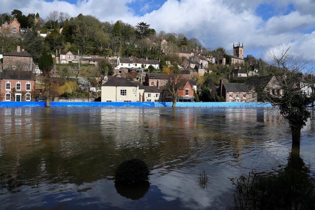 Flood defences are seen after being pushed back by high water levels on the River Severn, Ironbridge, on February 27, 2020.