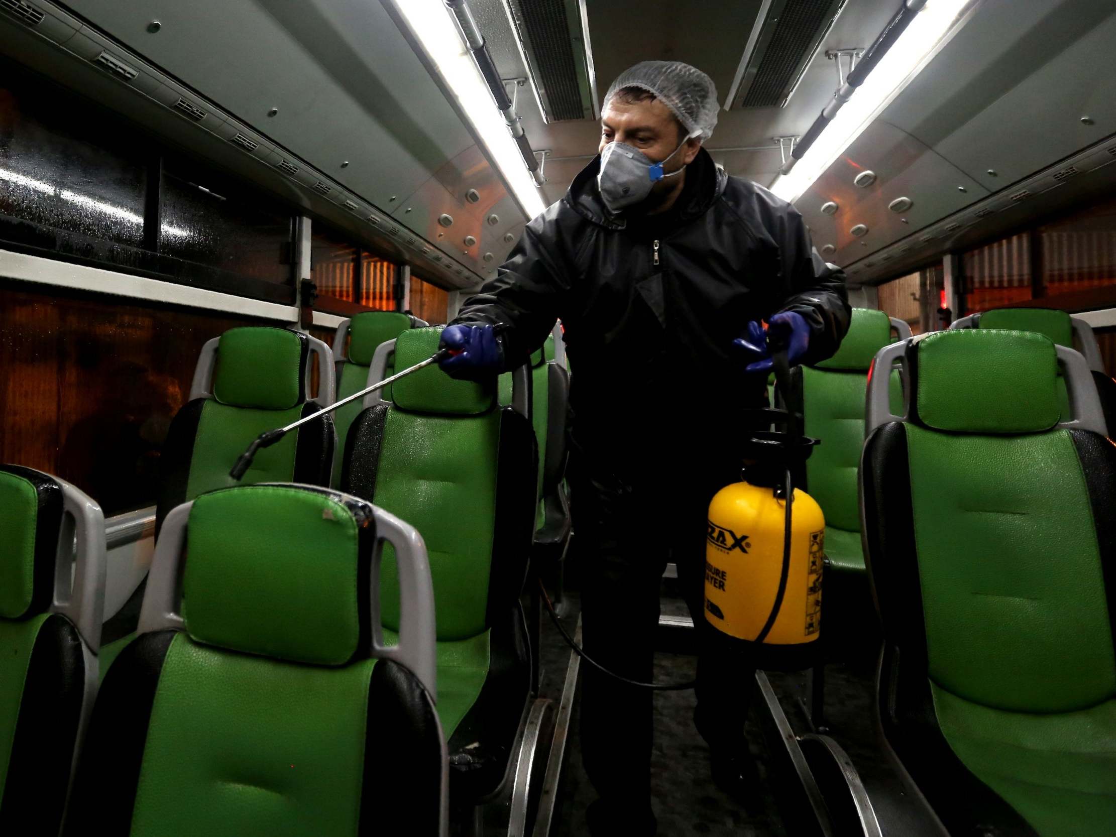 Disinfecting public transport: initial reports of the outbreak were met with amusement (AFP via Getty)