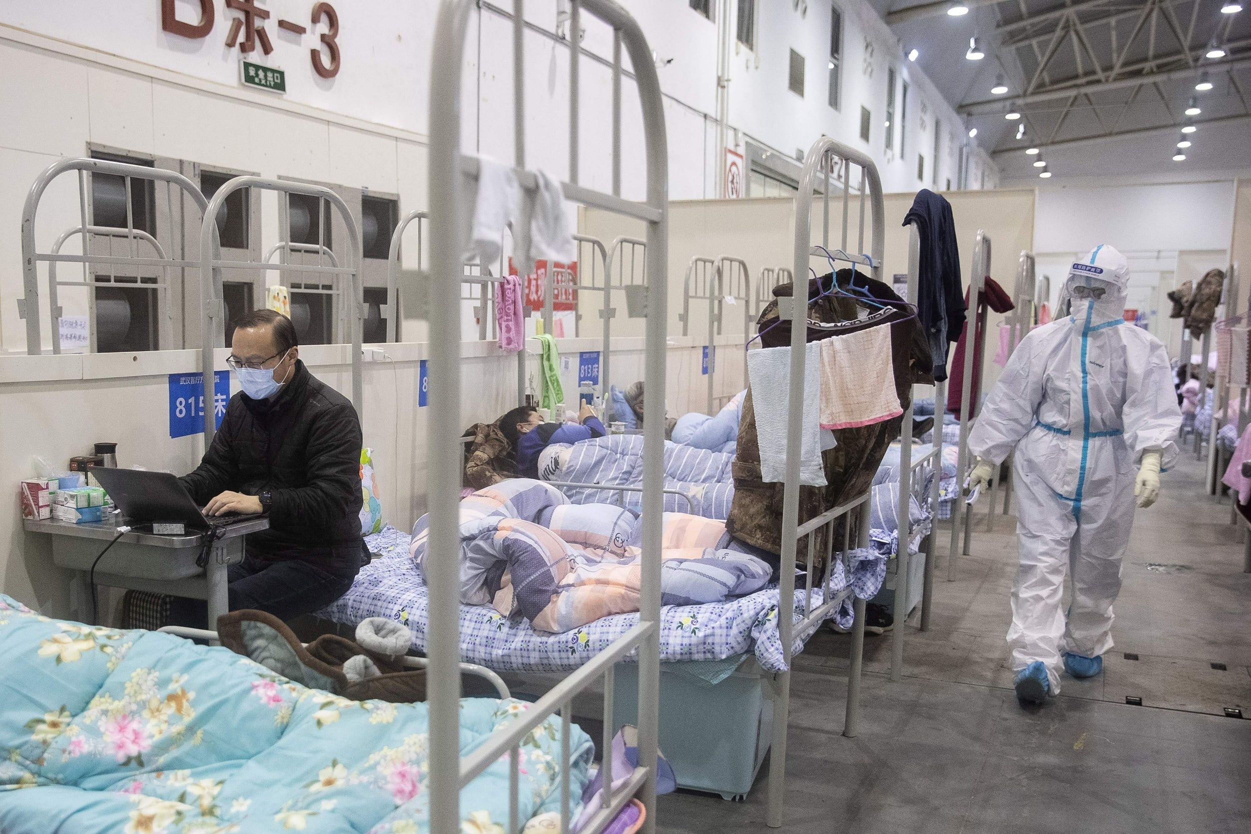 Coronavirus patients receive treatment at a hospital in Hubei province