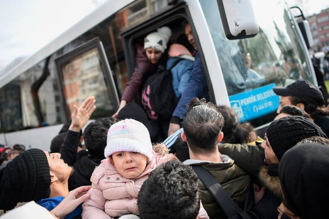 Syrian refugees board a bus as they head to border villages of Edirne province, in Istanbul, hoping to then cross into Europe