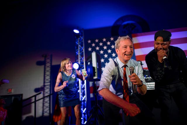 Tom Steyer dances onstage with rapper Juvenile singing Back That Azz Up during a rally ahead of the Democratic primary in South Carolina