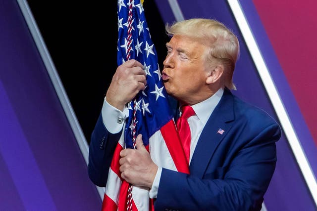 Trump kisses the US flag the annual CPAC