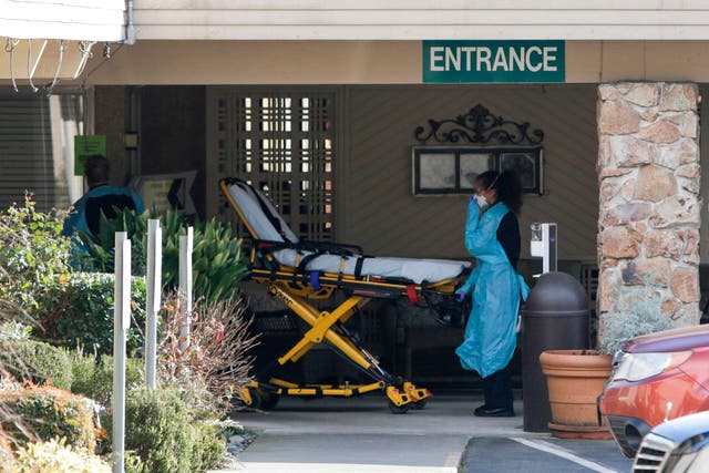 Health specialists at the Life Care Center in Kirkland, Washington, where a resident and an employee were confirmed as having the coronavirus