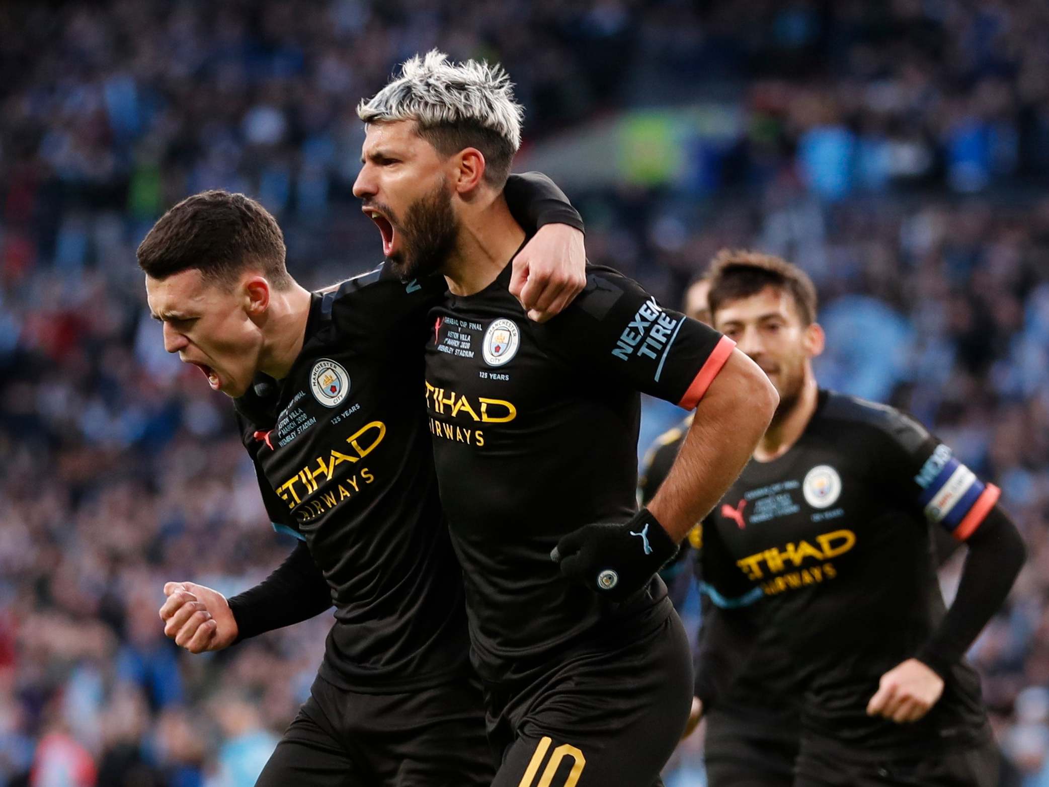 Phil Foden celebrates with Sergio Aguero after City took the lead