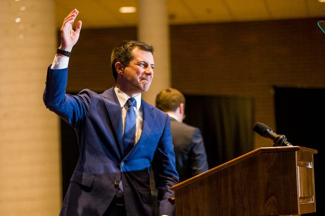 Pete Buttigieg waves to supporters after announcing that he is dropping out of the Democratic race