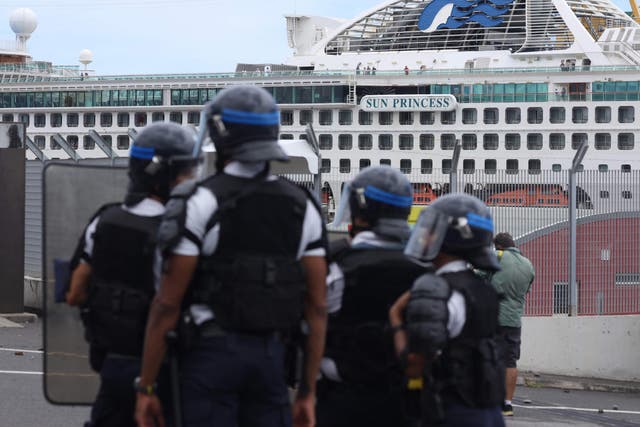 Protestors face off against passengers onboard Sun Princess