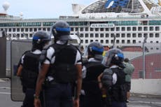 Rocks and bottles thrown at cruise ship over fears of coronavirus