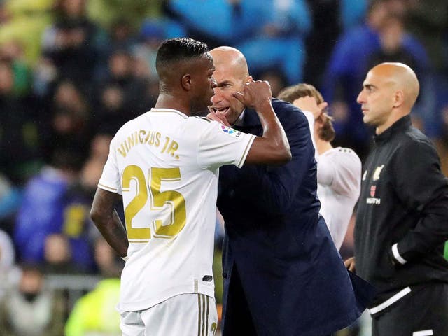 Zinedine Zidane celebrates with Clasico goalscorer Vinicius Junior