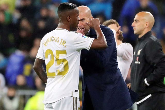 Zinedine Zidane celebrates with Clasico goalscorer Vinicius Junior