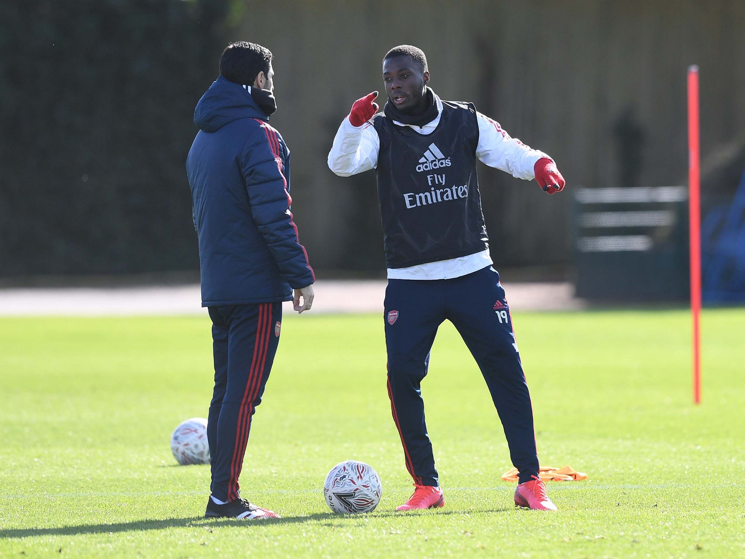 Mikel Arteta with Arsenal's record signing Nicolas Pepe in training