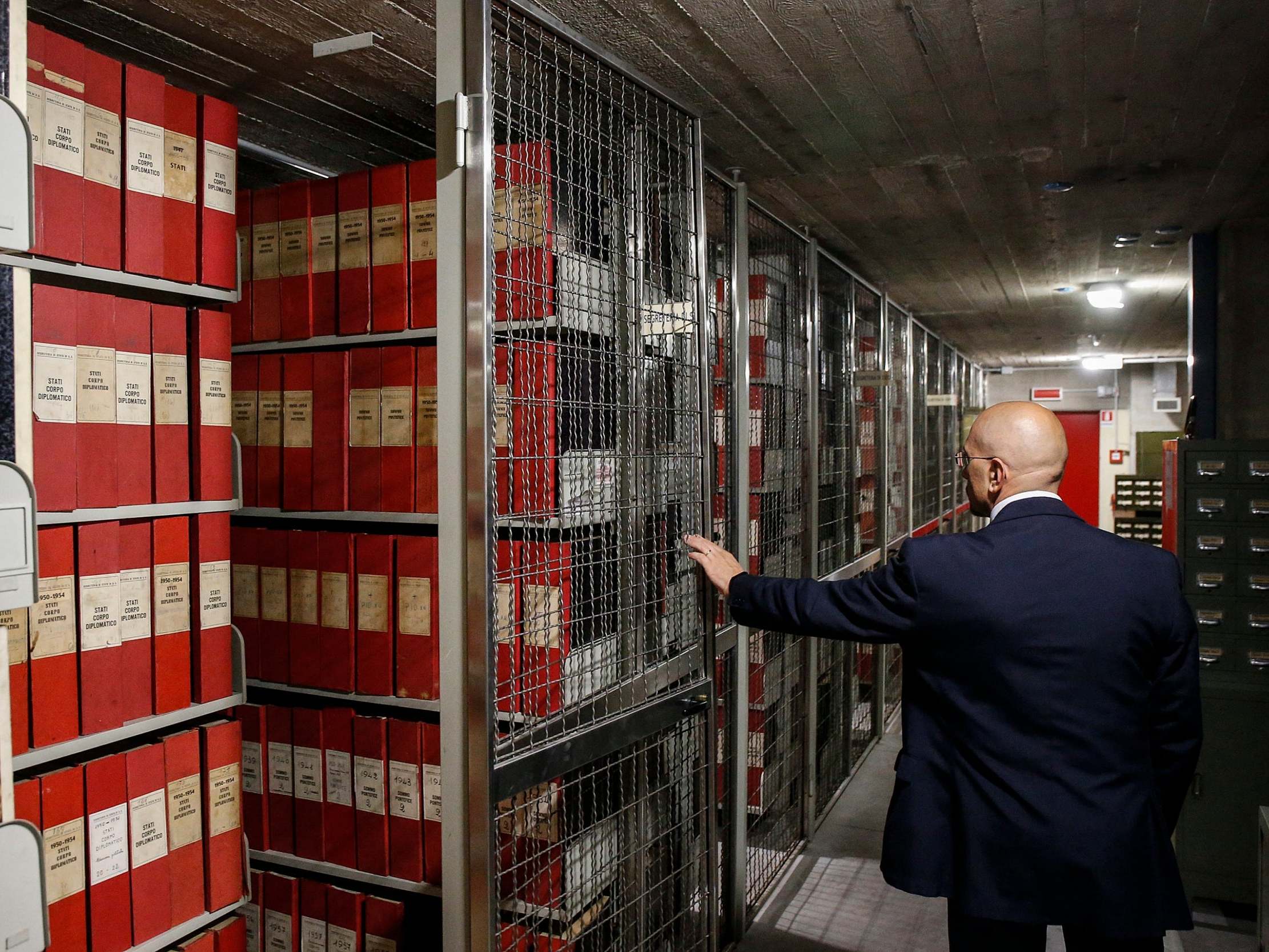 A man opens the archive section of the Holy See for the papacy of Pius XII, at the Vatican