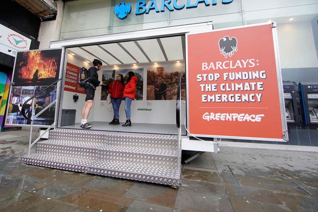 Protesters install pop-up exhibitions in front of the doors of branches