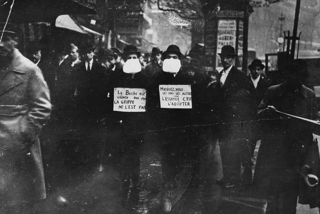 Two men advocating the use of flu masks in Paris during the Spanish influenza epidemic in 1919