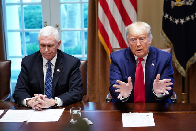 Donald Trump and Mike Pence, left, at a meeting with pharmaceutical executives in the Cabinet Room of the White House to discuss the coronavirus crisis