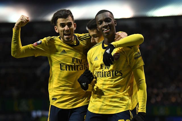 Eddie Nketiah celebrates scoring Arsenal's 2nd goal with Dani Ceballos and Gabriel Martinelli against Portsmouth