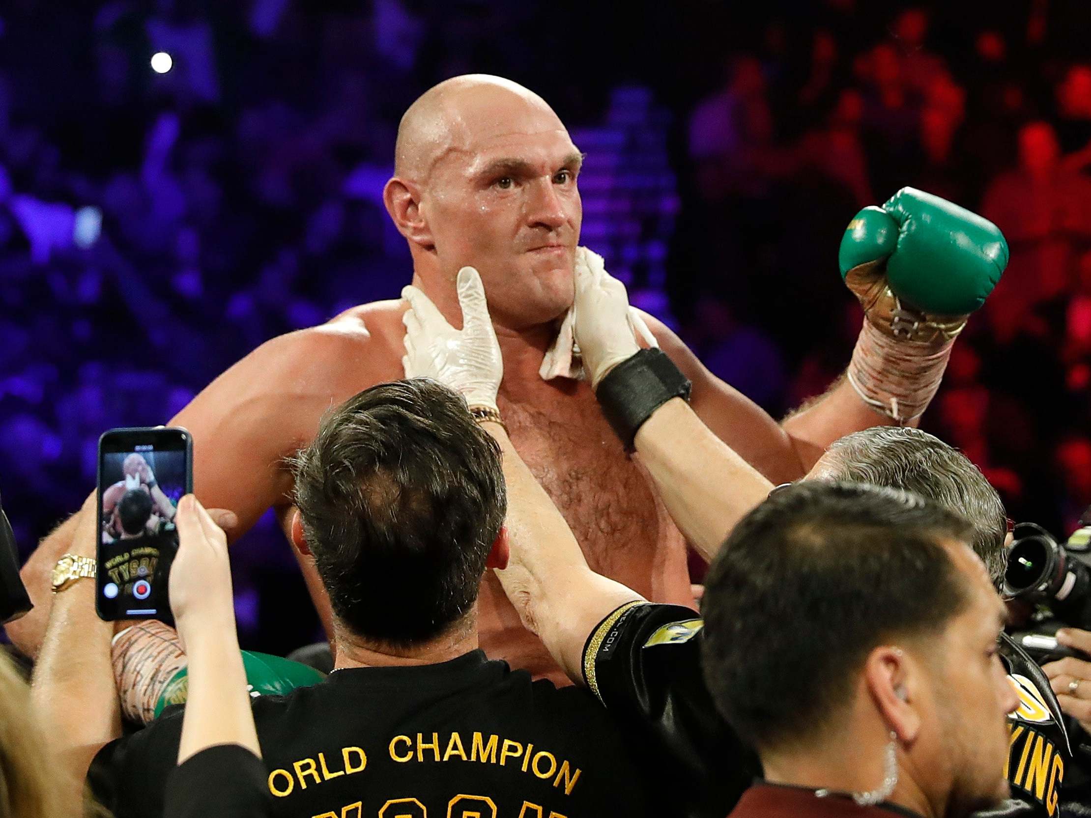 Tyson Fury celebrates after defeating Deontay Wilder