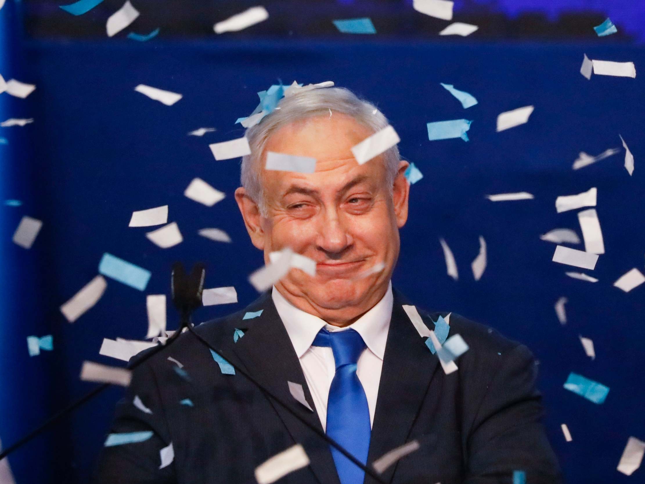 Israeli prime minister Benjamin Netanyahu smiles after first exit poll results on Monday