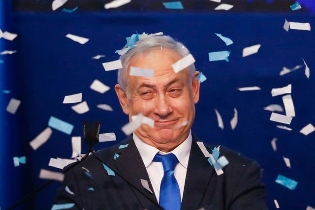 Israeli prime minister Benjamin Netanyahu smiles after first exit poll results on Monday