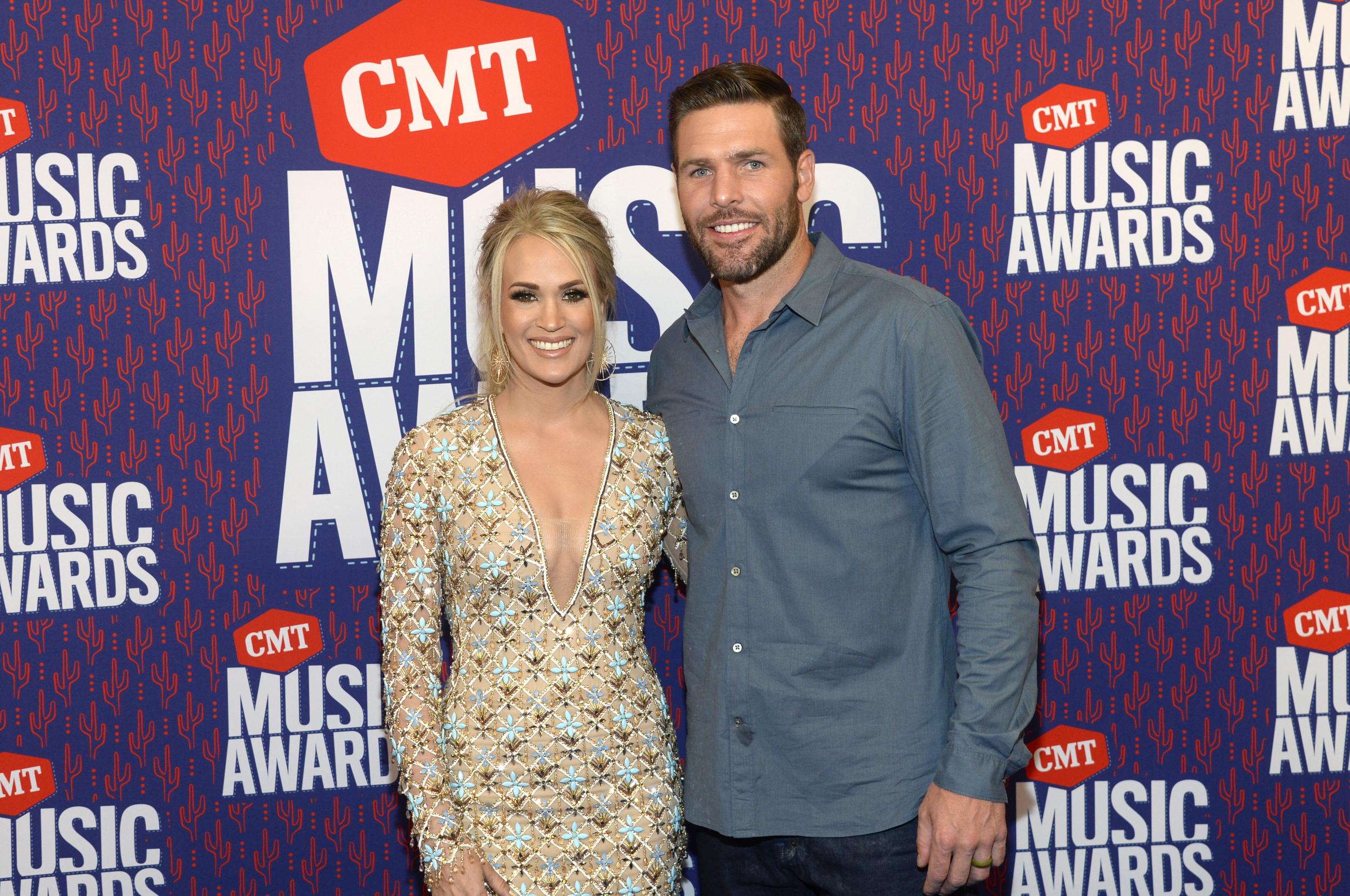 Carrie Underwood has revealed her husband Mike Fisher was forced to shelter with their children