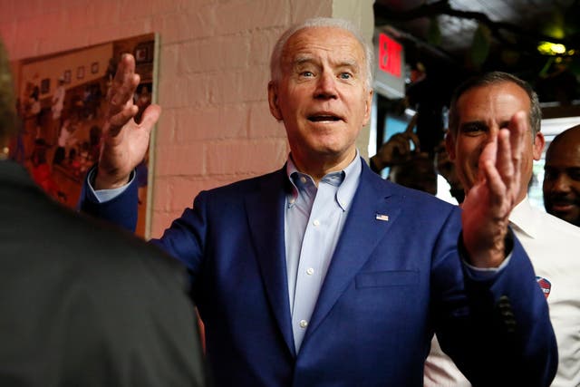 Joe Biden reacts to cheers from diners at a restaurant in Los Angeles, California on Super Tuesday