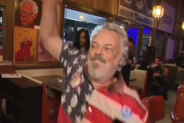 A man wearing a US flag shirt briefly interrupted Sky News' Super Tuesday coverage by dancing wildly in front of Kay Burley