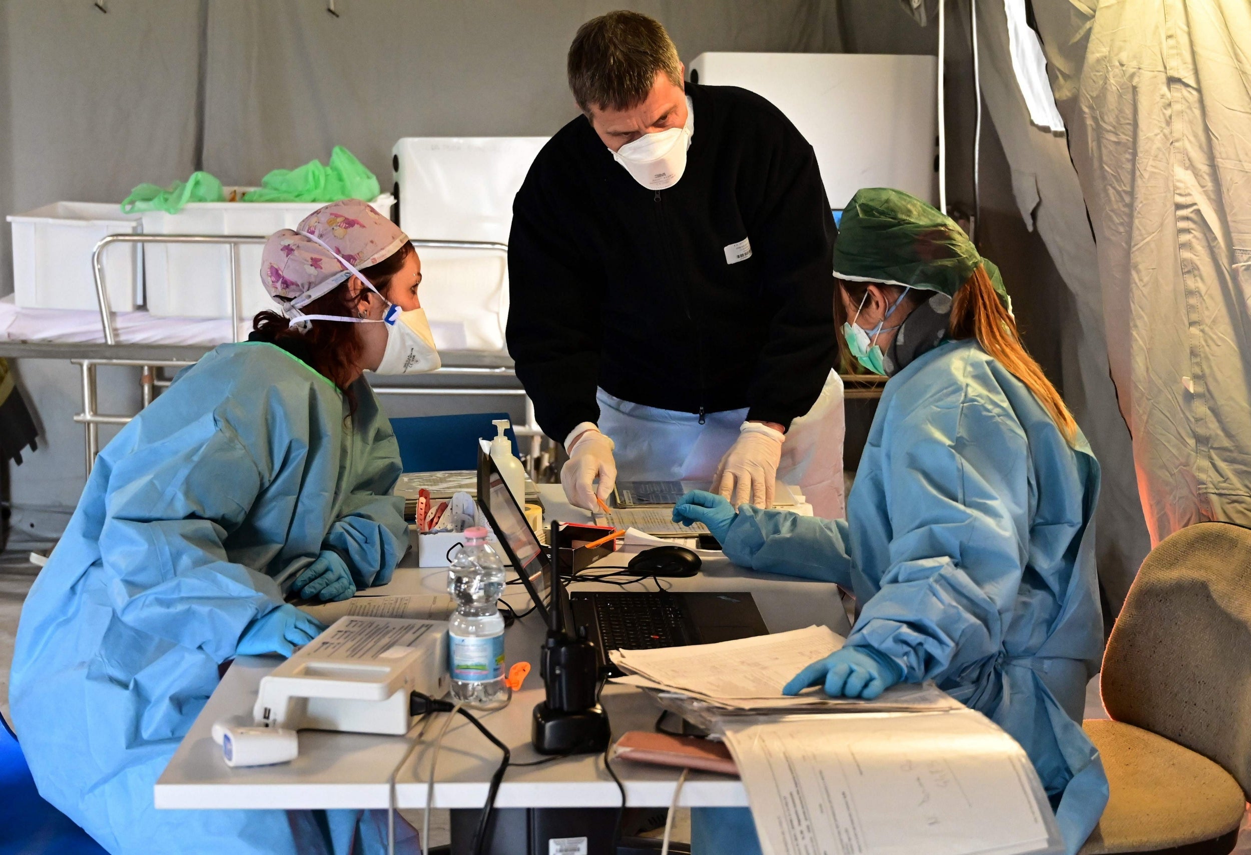 Medical personnel work in the a pre-triage medical tent located in front of the Cremona hospital