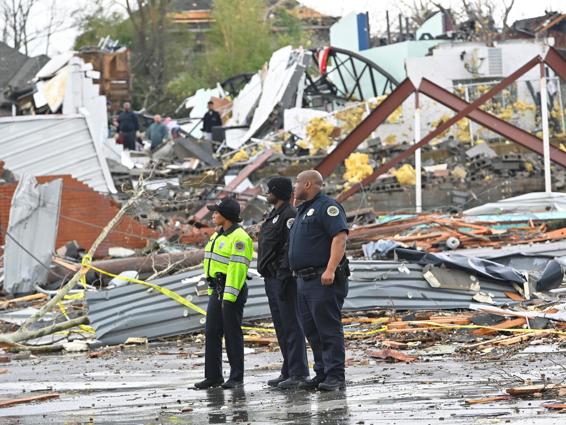 Police stand in front of destruction in Tennessee