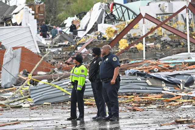Police stand in front of destruction in Tennessee