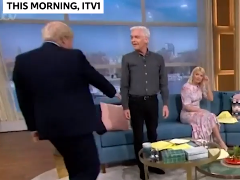 Philip Schofield tries to avoid shaking Boris Johnson&apos;s hand, but PM does it anyway