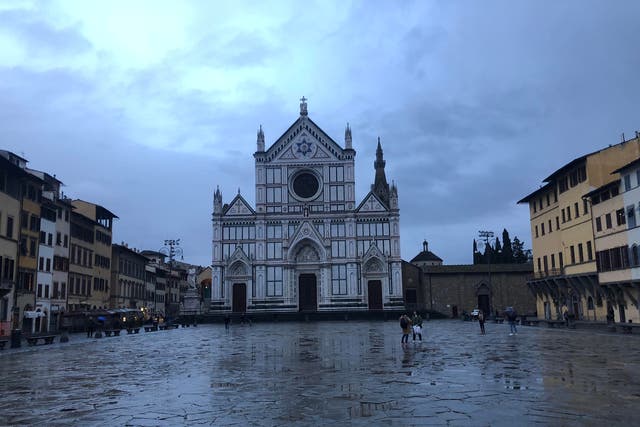 Florence's Basilica di Santa Croce looms over the abandoned Piazza as virus fears keep tourists away