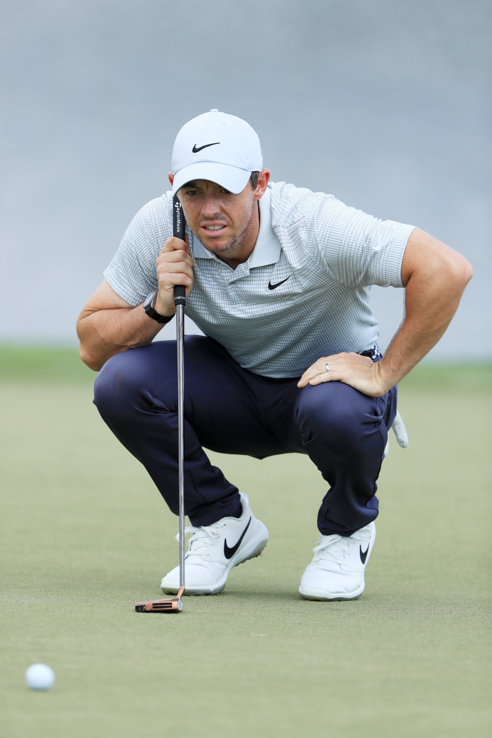 McIlroy lines up a putt at the Arnold Palmer Invitational