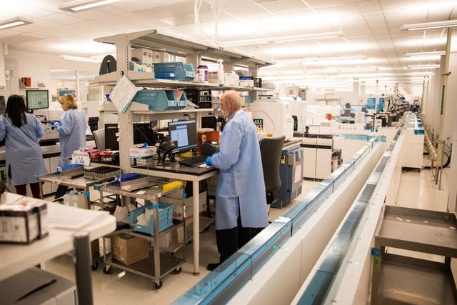 Employees work at Northwell Health Laboratories in Northwell Health's Center for Advanced Medicine in Lake Success, New York State on 4 March 2020