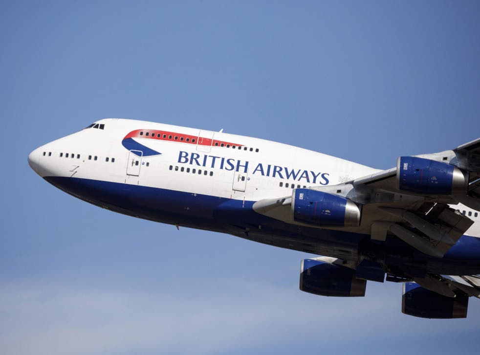 A British Airways aeroplane takes off from the runway at Heathrow Airport's Terminal 5 in west London