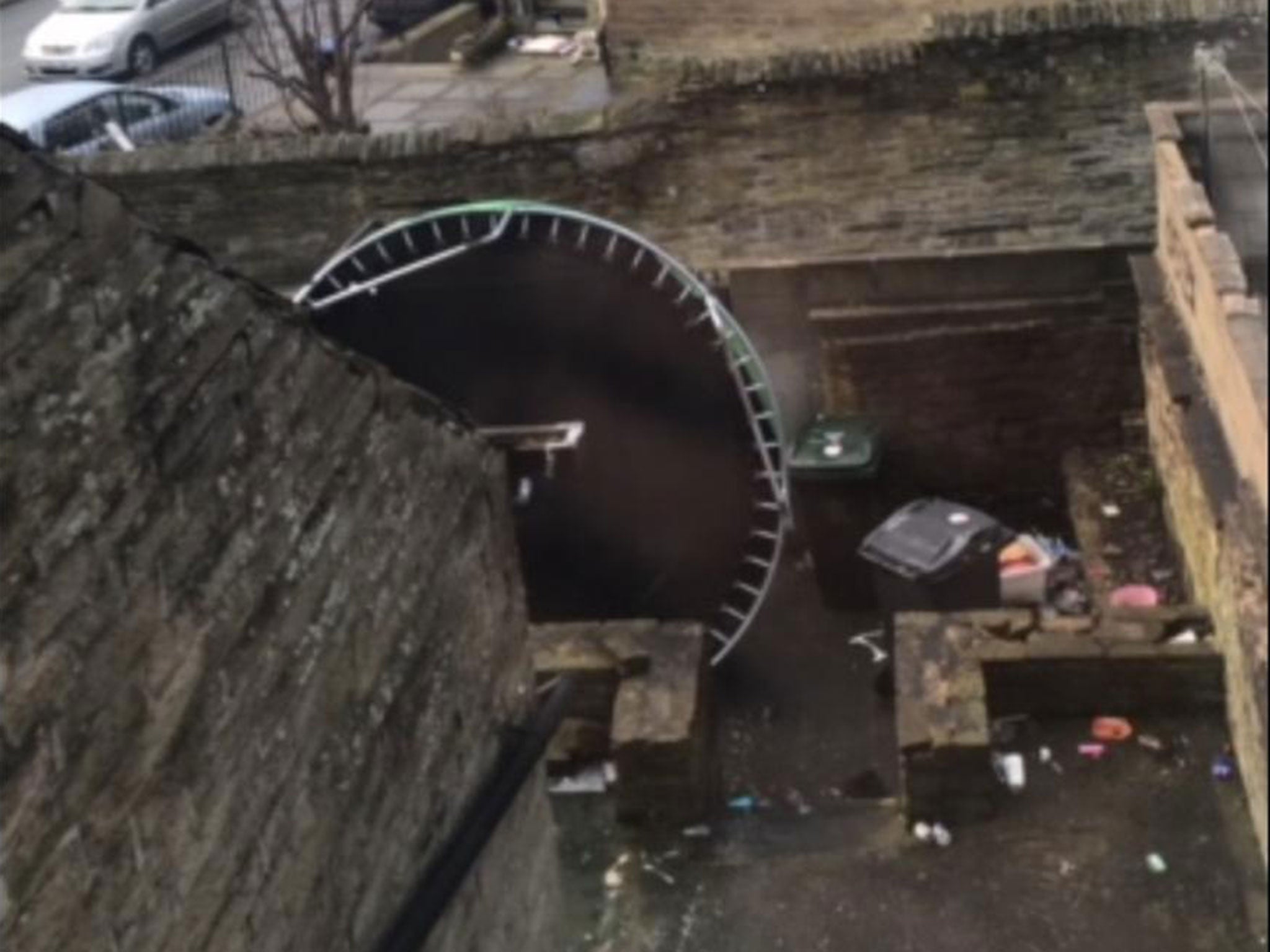 More vandalism: a trampoline on its side at the home of a Huddersfield grooming gang victim