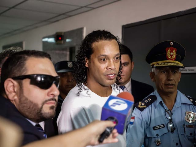 Ronaldinho arrives at the Palace of Justice to appear before Judge Mirko Valinotti in Asuncion