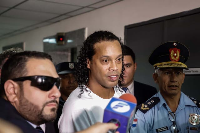 Ronaldinho arrives at the Palace of Justice to appear before Judge Mirko Valinotti in Asuncion