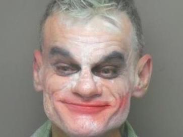 Jeremy J Garnier, 51, was dressed as the Joker when police arrested him for making terrorist threats via livestream