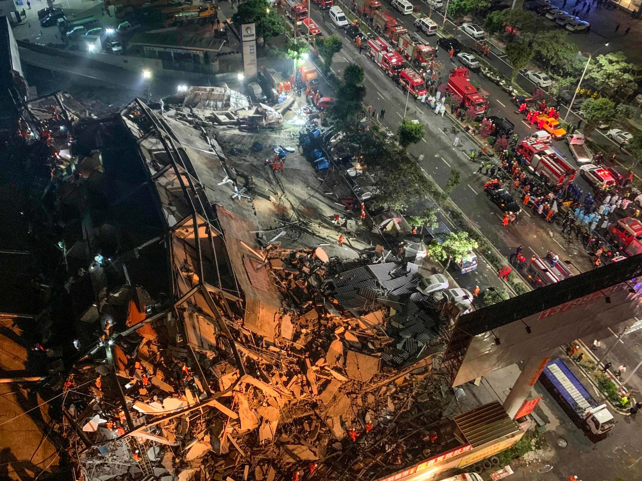 Rescuers search for survivors in the rubble of a collapsed hotel in Quanzhou