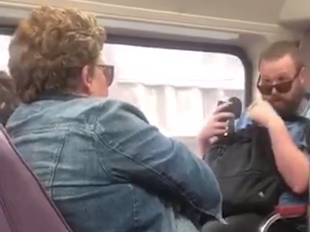 A pair of commuters argue on a train in Sydney amid coronavirus fears