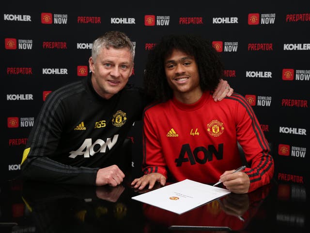 Manchester United manager Ole Gunnar Solskjaer with Tahith Chong