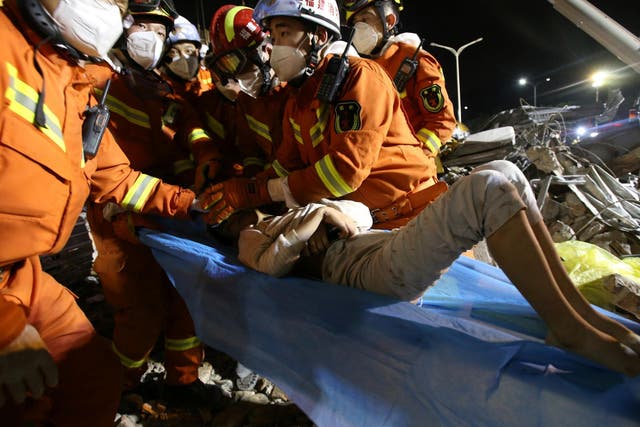 Ten-year-old boy is rescued from the rubble of a collapsed hotel