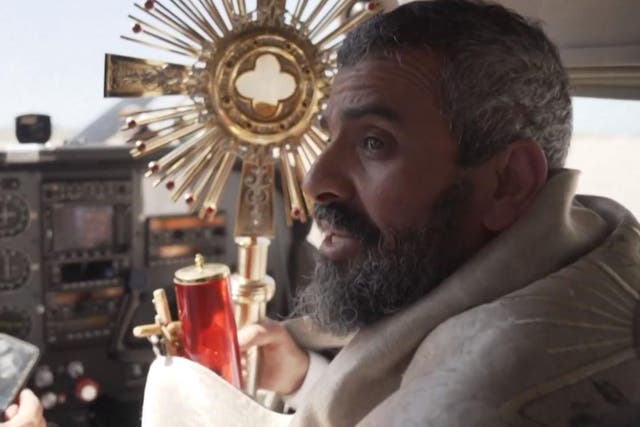 Christian Maronite priest Majdi Allawi flew over Beirut and other areas in Lebanon with a monstrance over the weekend